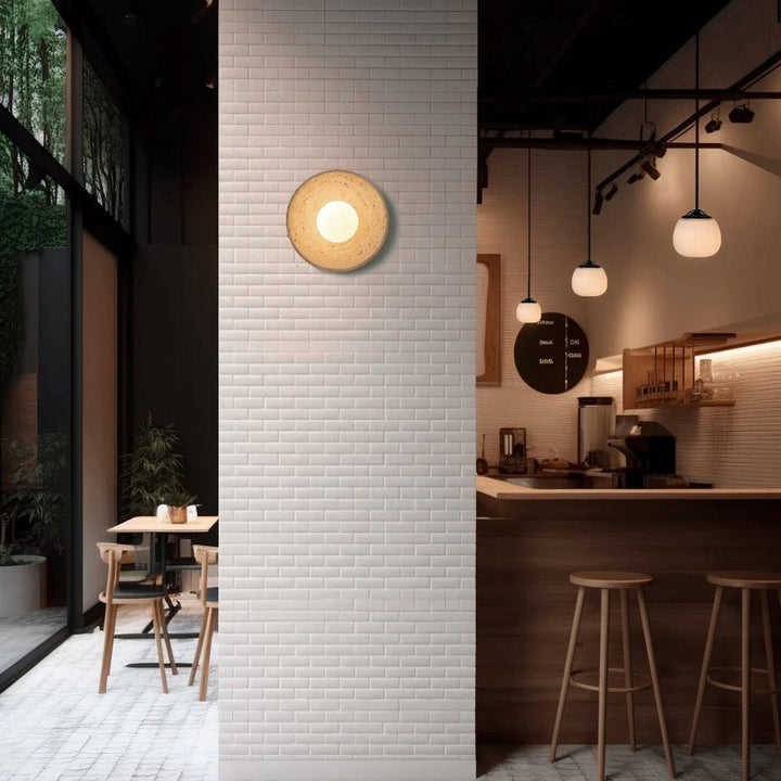 Orba | Applique a disco in travertino